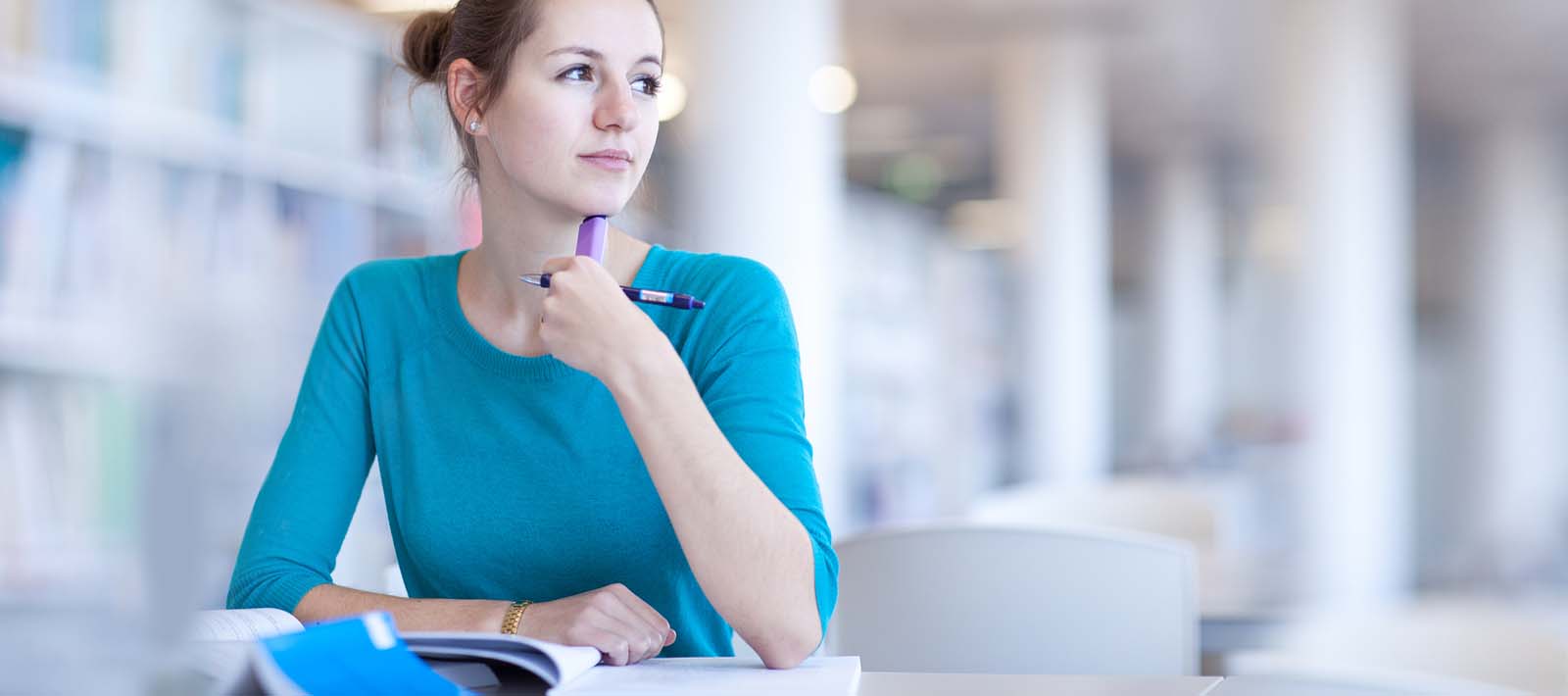 Teenage student in library