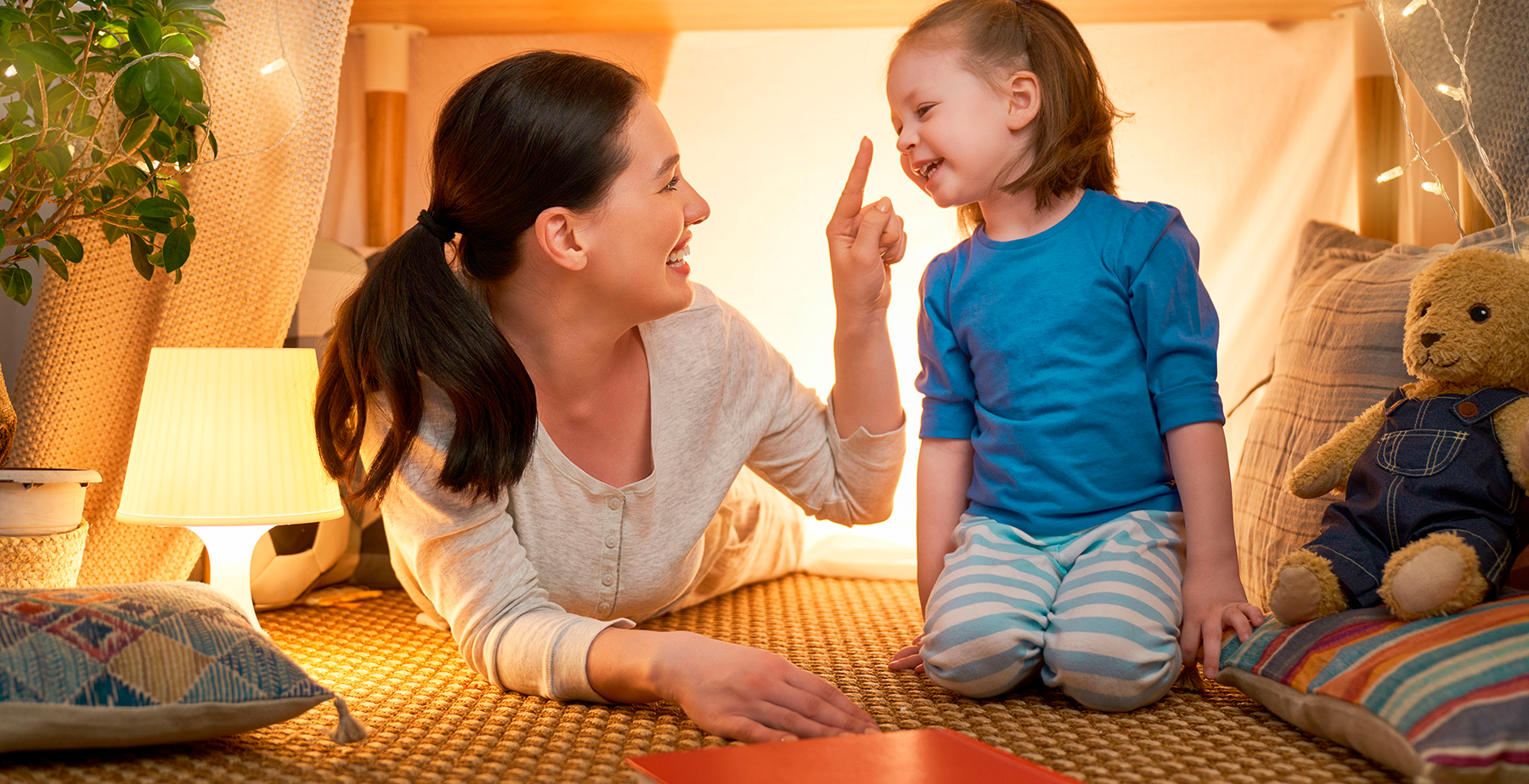 Mother with Special Needs Child Playing in Child's Room