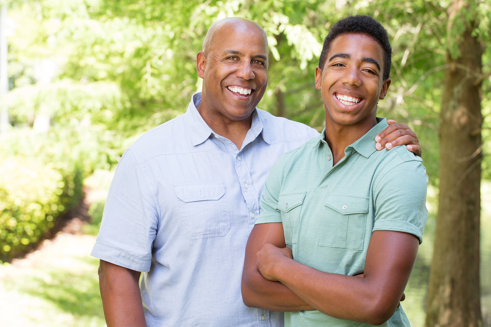 African American father and son in park