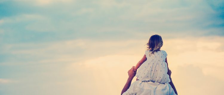 Father and Daughter Playing Together at the Beach at Sunset. Hap