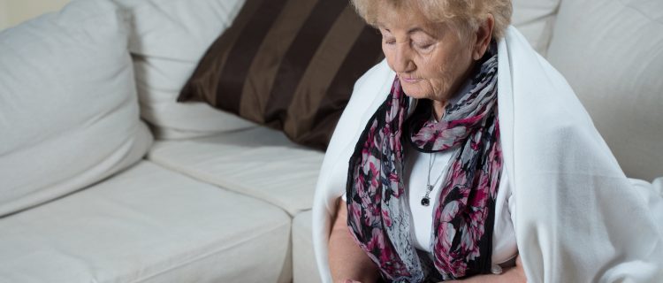 Senior Woman Playing Cards Alone